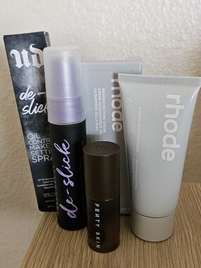 Urban Decay De-Slick Setting Spray, Rhode Barrier Cream And Fenty Lip Oil
